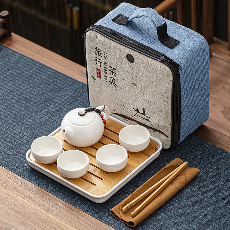 Travel bag ceramic Kung Fu tea set, including a teapot, four cups, and a melamine tea tray; a complete portable business gift/conference set.