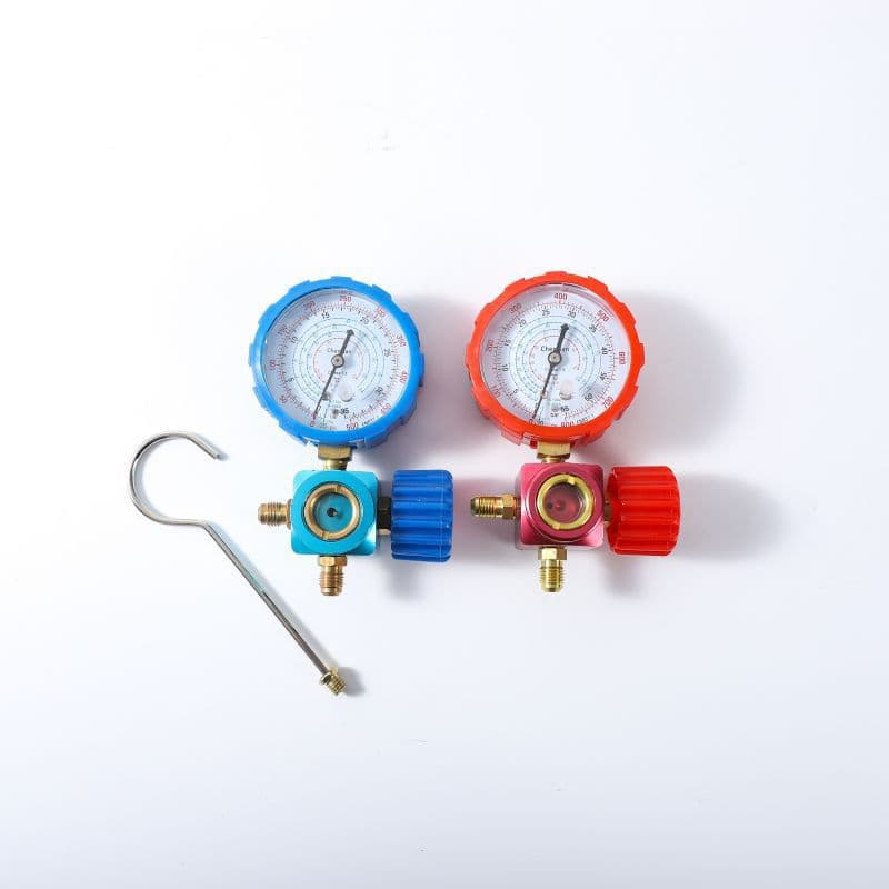 Complete set of automotive air conditioning charging tools including manual high-low pressure single gauge valve, vacuum negative pressure gauge, and refrigerant pressure gauge