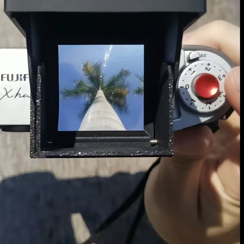 DIY waist-level viewfinder with 3D printed housing and 50mm Fresnel lens for landscape viewing.