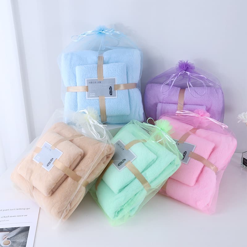Manufacturer in stock, towel and bath towel parent-child set, warp-knit coral fleece trimmed edge absorbent event gift towel wholesale.