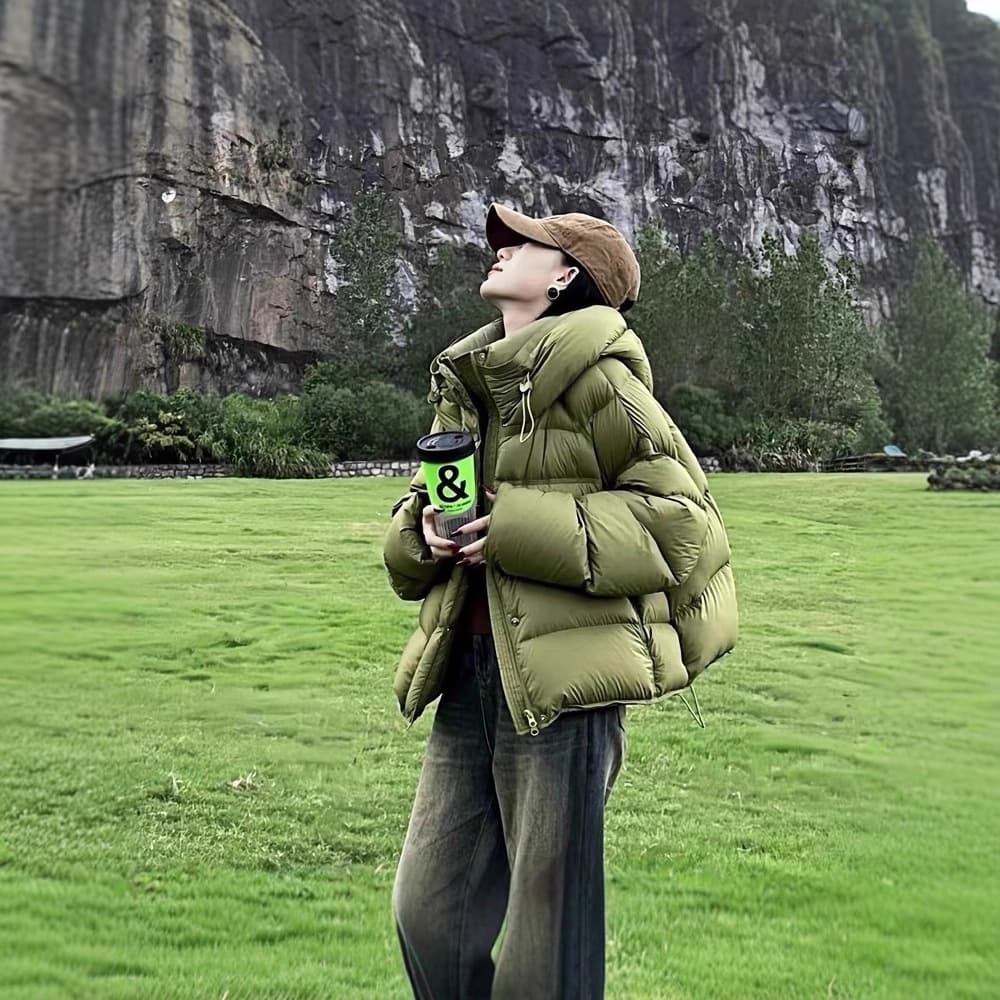 Women's short down-filled cotton-padded jacket in green, style suitable for winter 2025; lime green hooded puffer jacket.