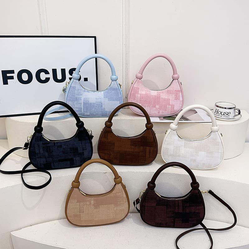 French niche foreign style hand-held dumpling bag for women 2026 new trendy fashion single shoulder messenger bag commuter hand bag