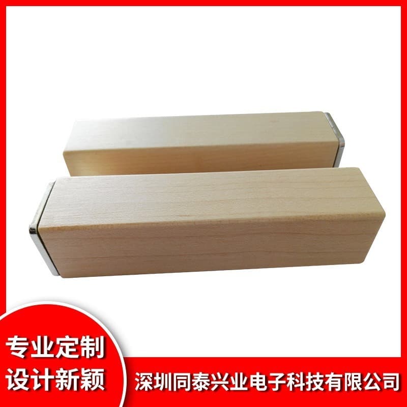 Custom-made cylindrical and square single-section bamboo and wood portable power bank casing with USB-C and Android ports.