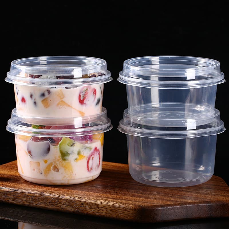 Commercial takeaway boxes for fruit salad, ice jelly bowls with lids, round taro balls, desserts, grass jelly, and sago pudding.
