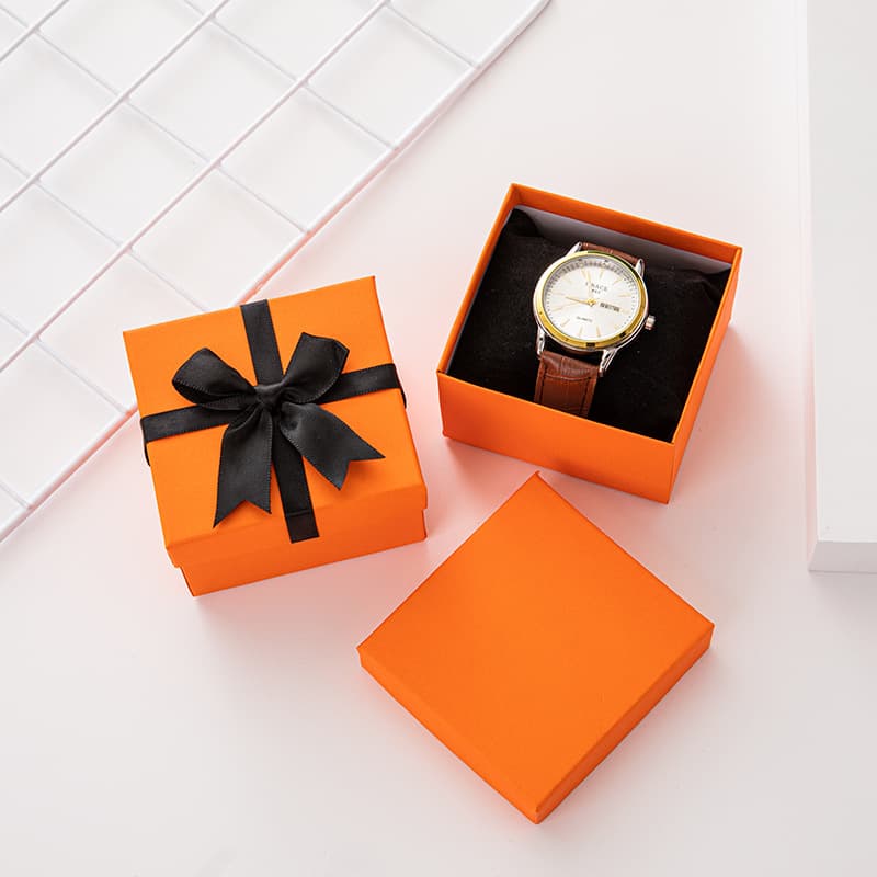 Factory direct wholesale orange watch boxes with bow-tie lids, watch display boxes, and cardboard boxes in stock.