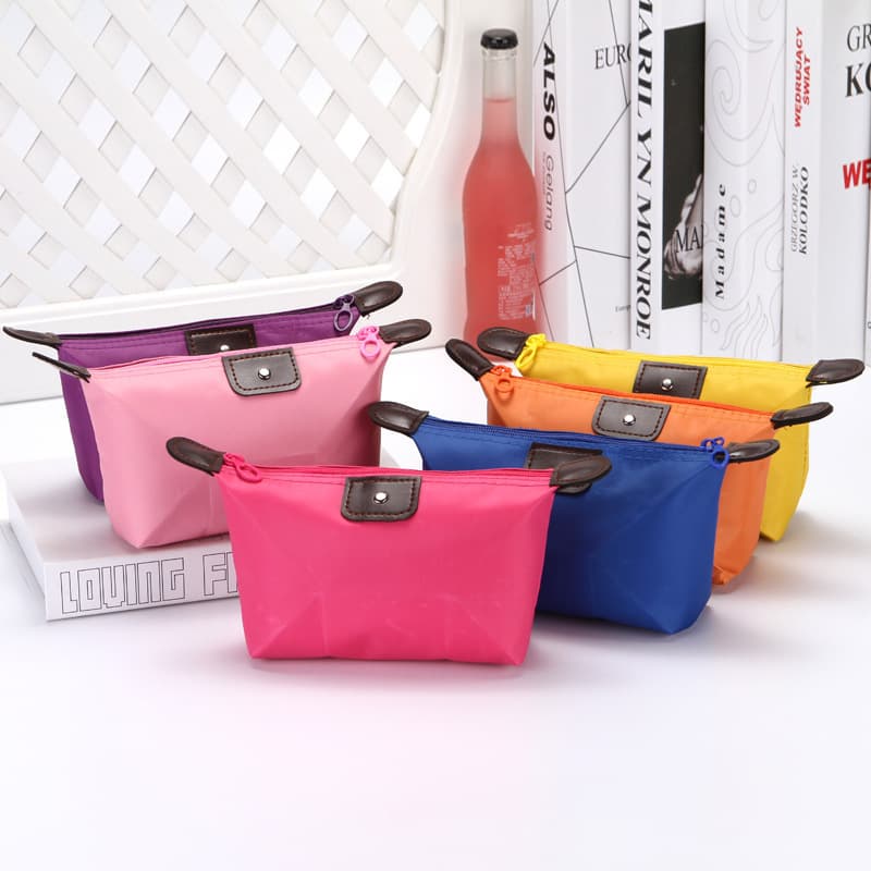 Candy-colored multi-functional portable cosmetic bag, nylon dumpling-shaped cosmetic bag, waterproof storage toiletry bag wholesale.