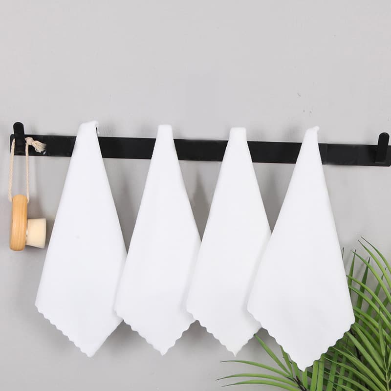 Warp-knitted microfiber white square towel with lace trim, suitable for use in bathhouses, hotels, and as disposable napkins.