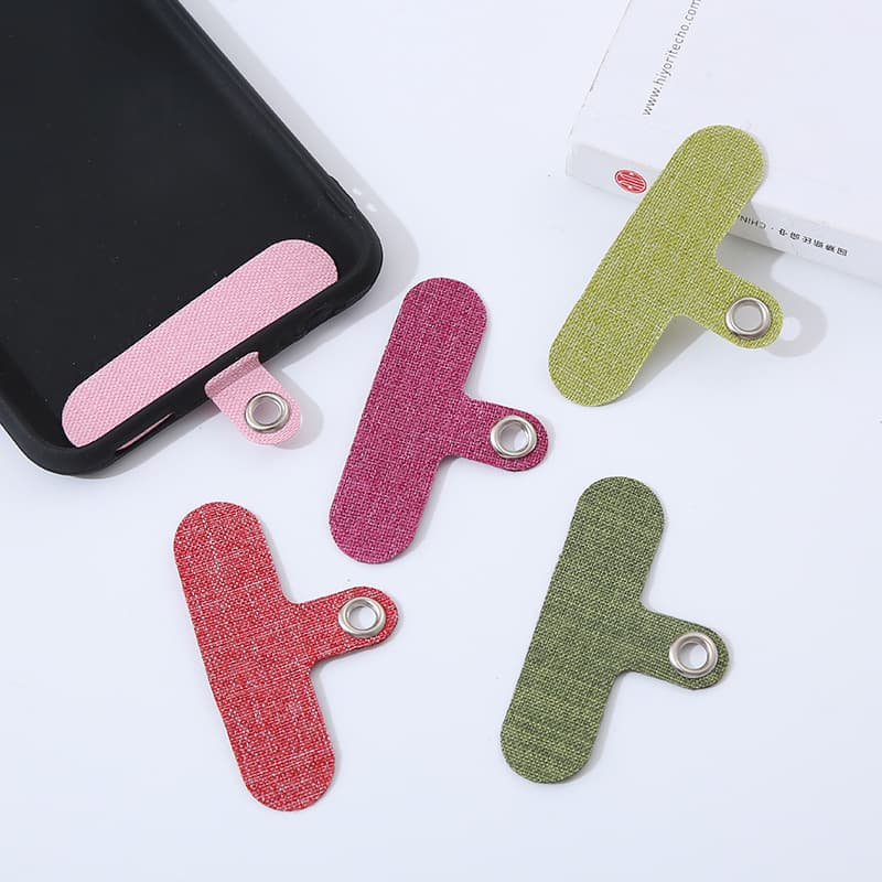 Factory direct stock of mobile phone lanyard pads, phone case clips, multi-purpose lanyard pads wholesale.