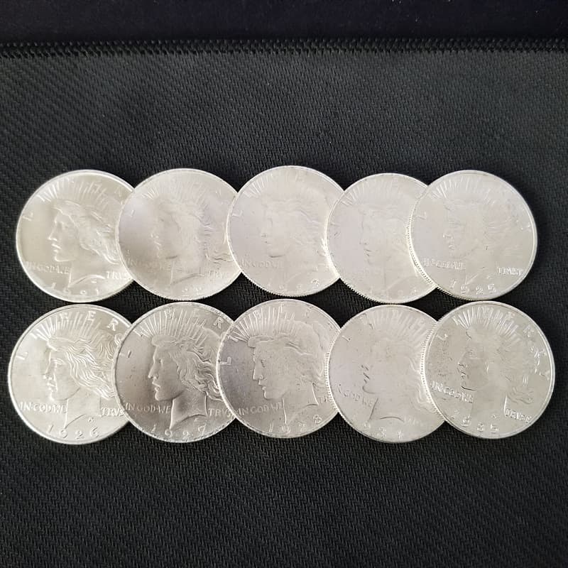 10 White Copper Replicas of the Statue of Liberty and the Dove of Peace