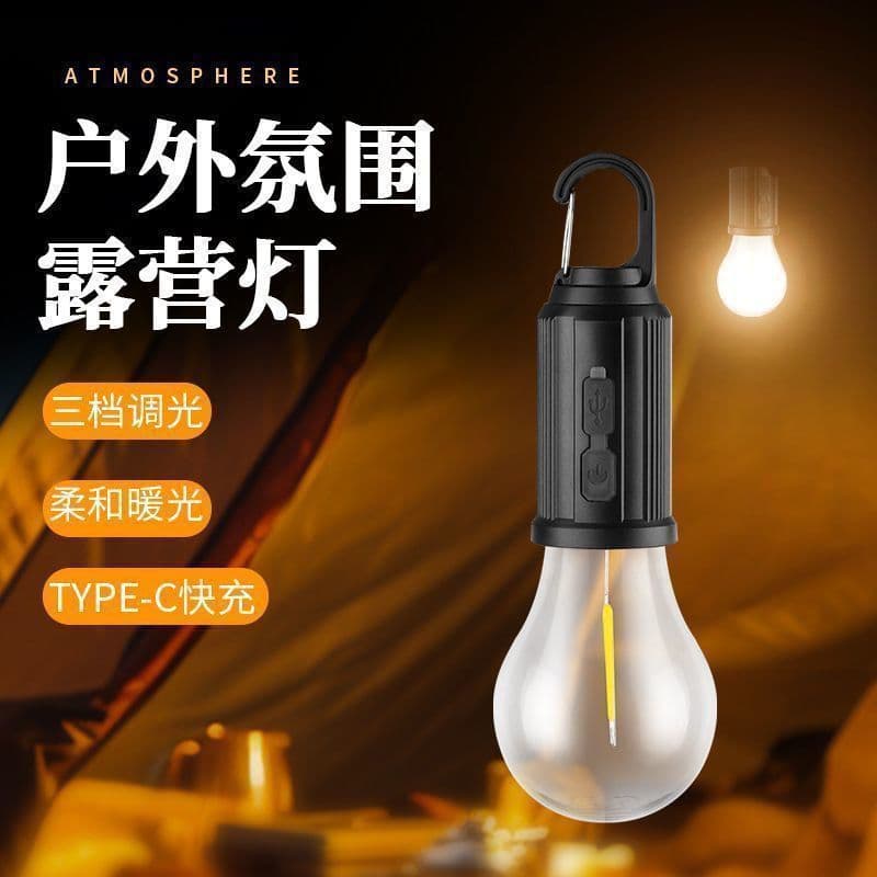 Solar-powered camping light with retro-style LED tungsten filament for tent emergency bulb illumination.