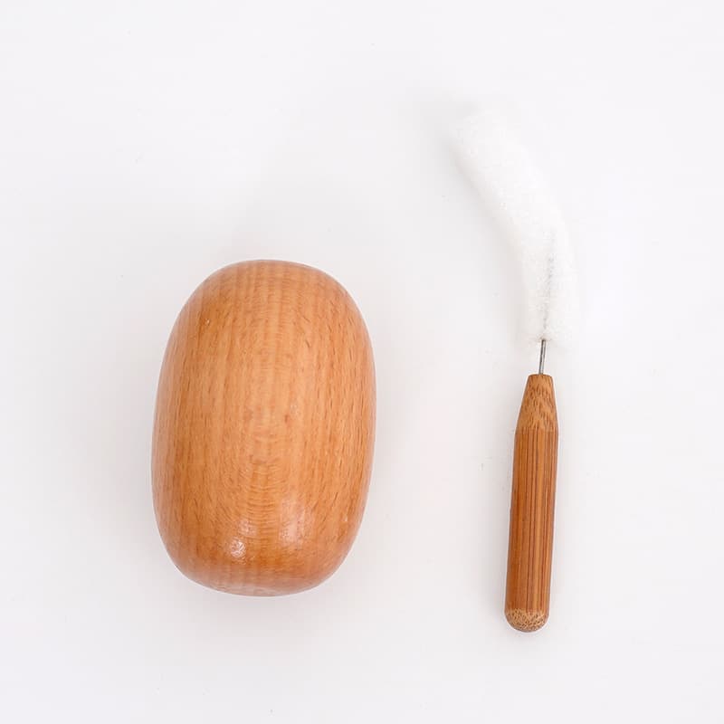 Egg-shaped knitting tool for patching holes in sweaters. Crochet storage patch supplies for patching holes in clothes. DIY knitting tools.