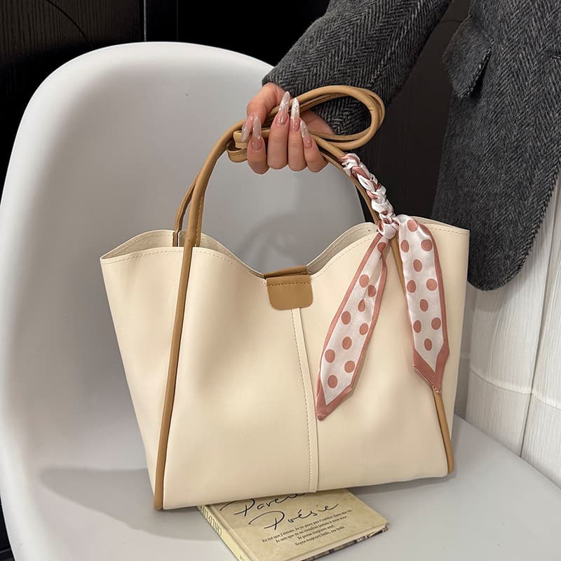 Commuting tote bag large capacity 2026 new mother-in-law bag portable fashion commuting shoulder armpit versatile bucket bag