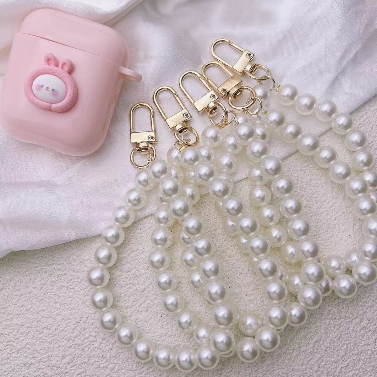 Cute key chain doll handmade pendant exquisite Korean version personalized creative school bag earphone shell pendant simple wholesale