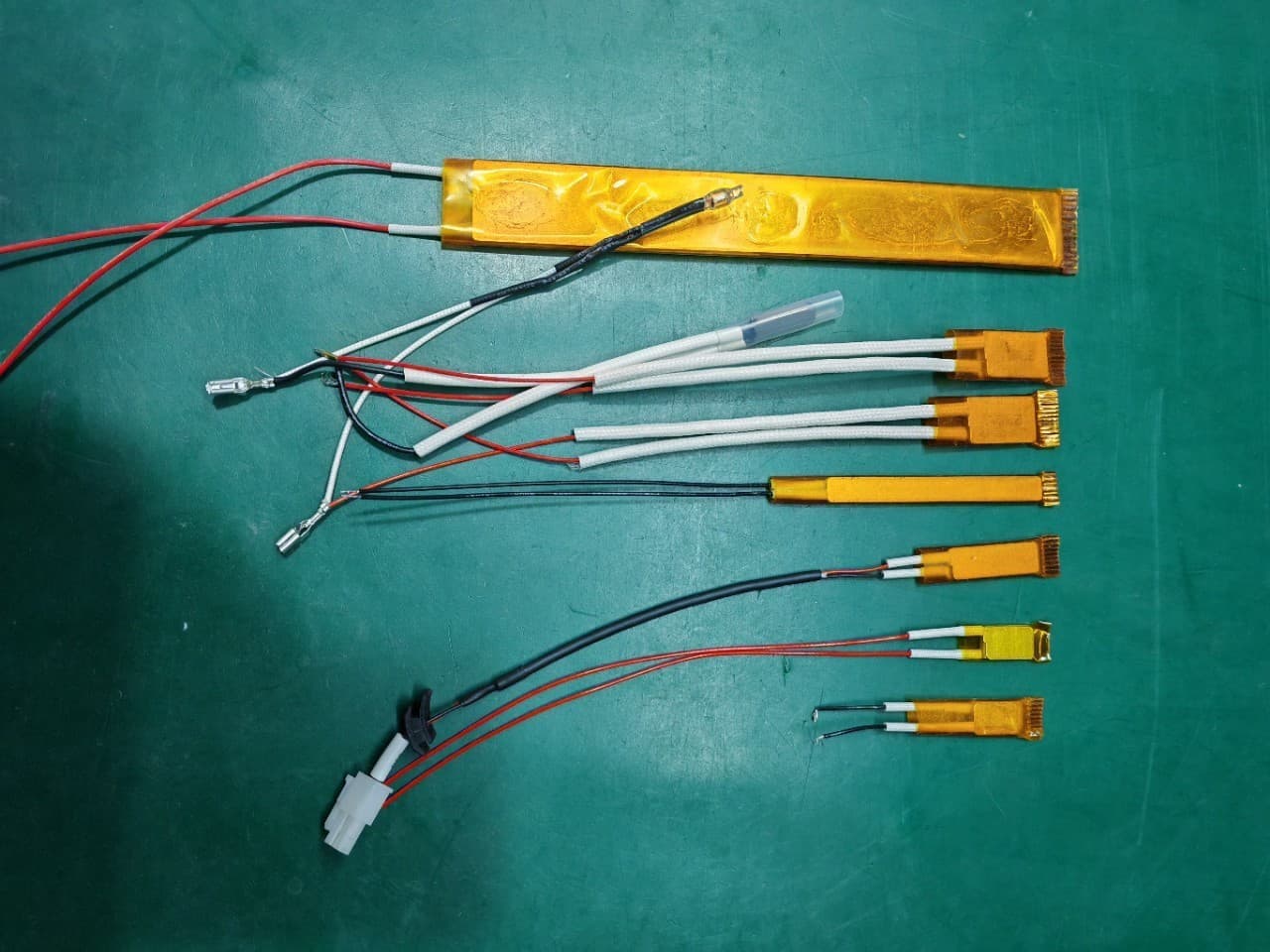 PTC heating element for electric hairbrushes, hair straighteners, curling irons, yogurt makers, and wax melters