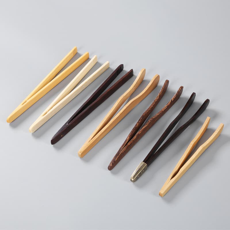 Ebony bamboo tea tongs and tweezers for cup handling, part of the tea ceremony six essentials, wholesale with logo engraving support.