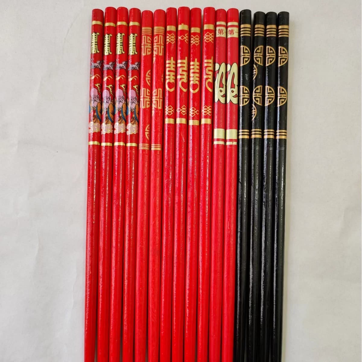 Factory wholesale 24*7.0 black/red festive chopsticks for wedding banquets, bamboo chopstick utensils, OPP independent packaging, bestseller.