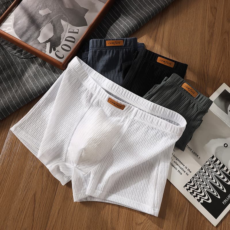Ice silk men's underwear men's boxer briefs 2026 new summer ultra-thin breathable teenager students solid color shorts head