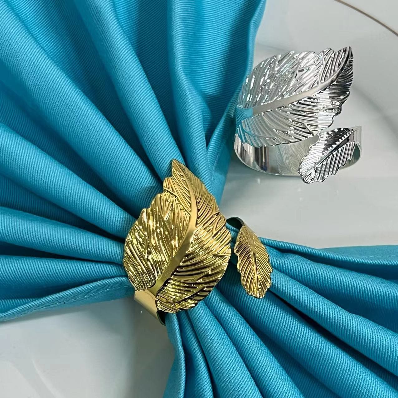 Creative new gold leaf napkin ring, large and small leaf napkin buckle, high-end and simple napkin ring manufacturer wholesale.