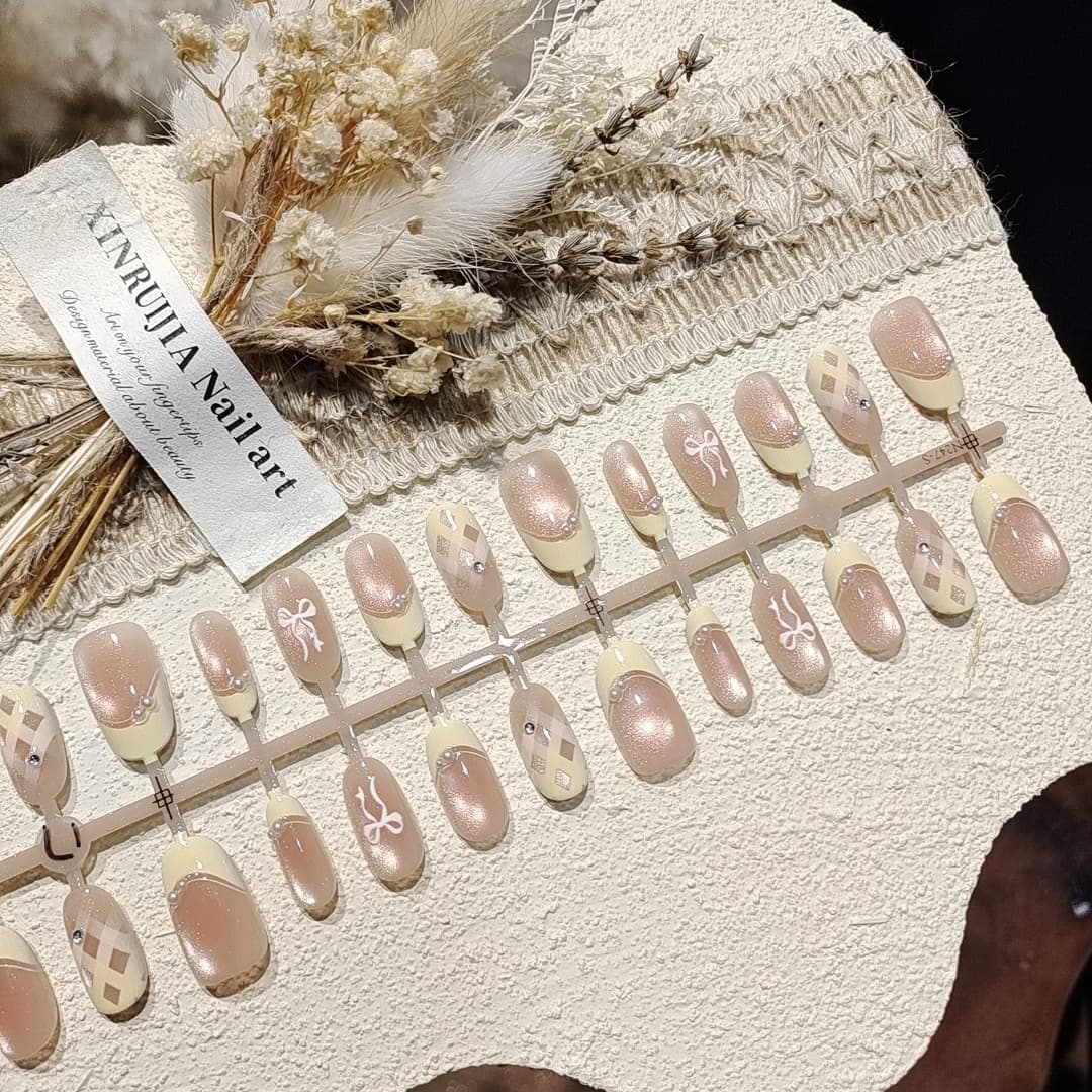 Sweet Apricot Milky White Short Oval Press-On Nails with Yellow French Tip and Pearl Decoration, Elegant and Gentle Style from Nail Factory
