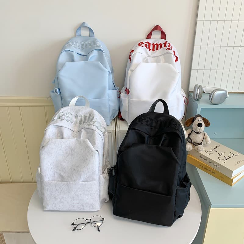 Simple middle school and high school student schoolbags for girls 2026 new large capacity solid color backpacks for short-distance travel backpacks for men