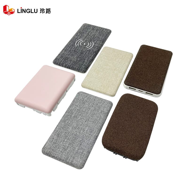 Manufacturer of flat heat-applied fabric coverings for wireless charging banks; massage fabric covering processing and hot-press molding process.