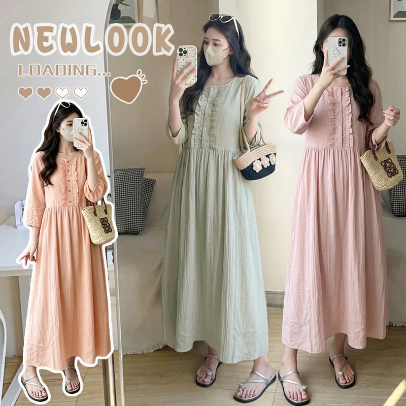 Skin-friendly linen dress with elegant ruffled round neck, three-quarter sleeves, and flowing long silhouette