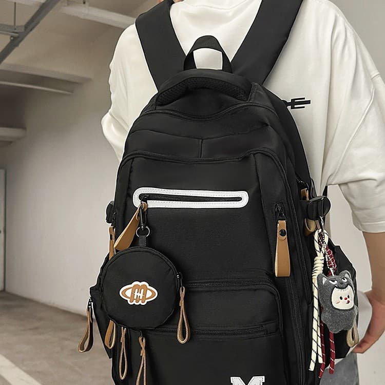 2026 spring and summer large-capacity spine protection and load-reducing backpacks for male and female college students, middle school students and high school students, suitable for school bag travel