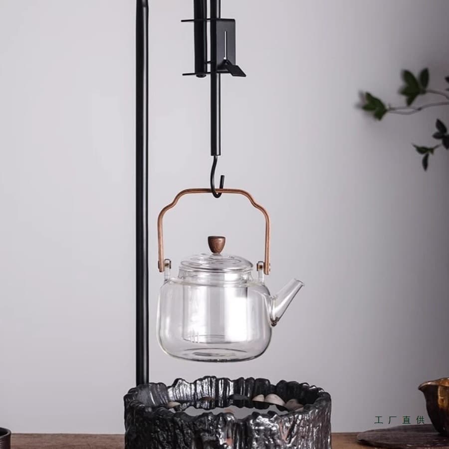 Enjoy the freedom of cooking tea around a stove. Tabletop free-flowing hook accessories for electric ceramic stoves, charcoal stoves, and iron kettles. Retractable hanging hook.