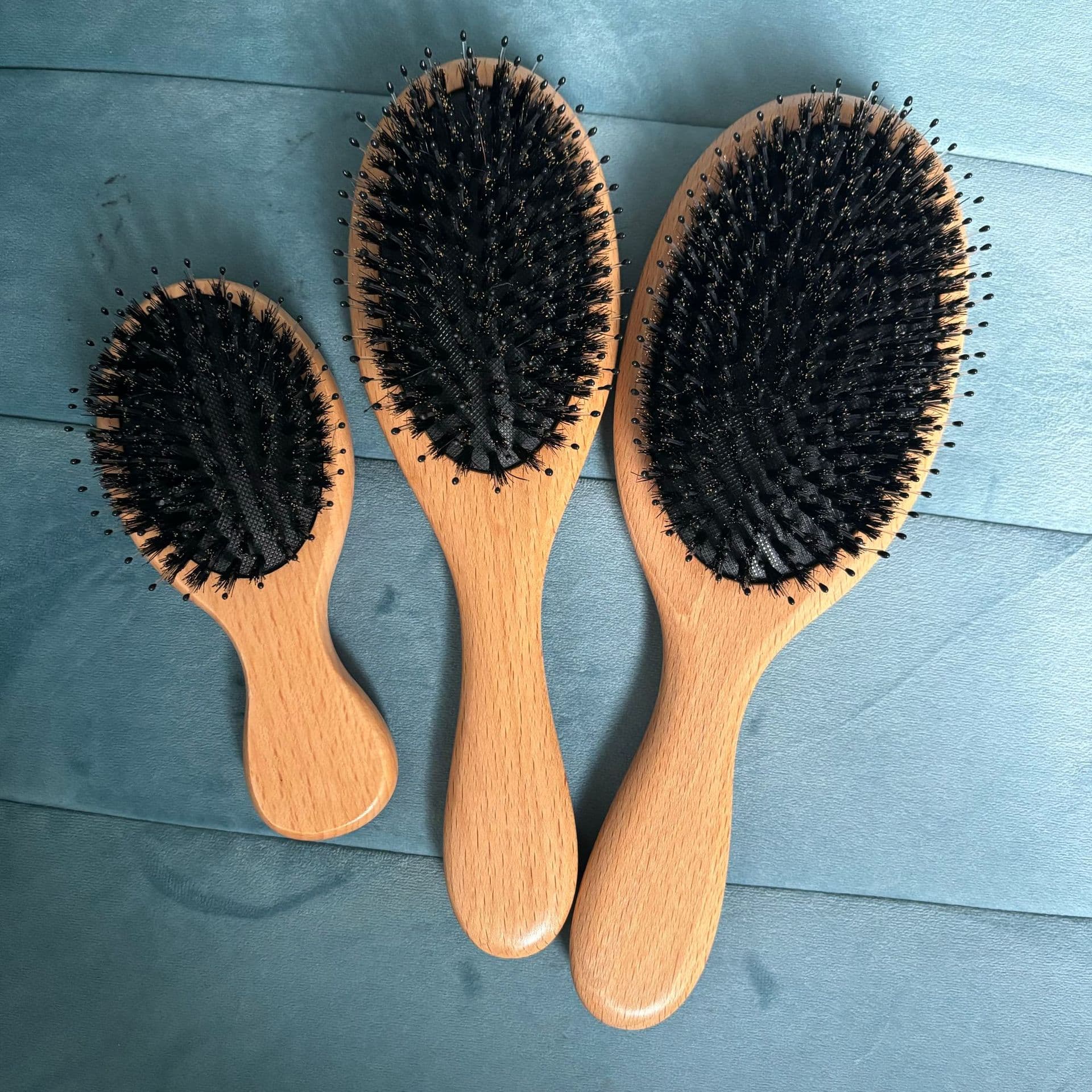 Manufacturer of beech wood boar bristle air cushion comb, wooden hairbrush with beech wood handle and nylon needles, air cushion hairbrush.