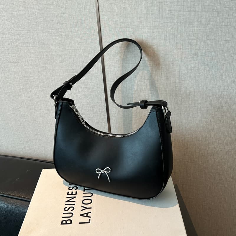 Crescent-shaped bag, a fashionable and high-quality women's bag for cross-border trade, featuring a retro bow design, suitable as an underarm or shoulder bag.
