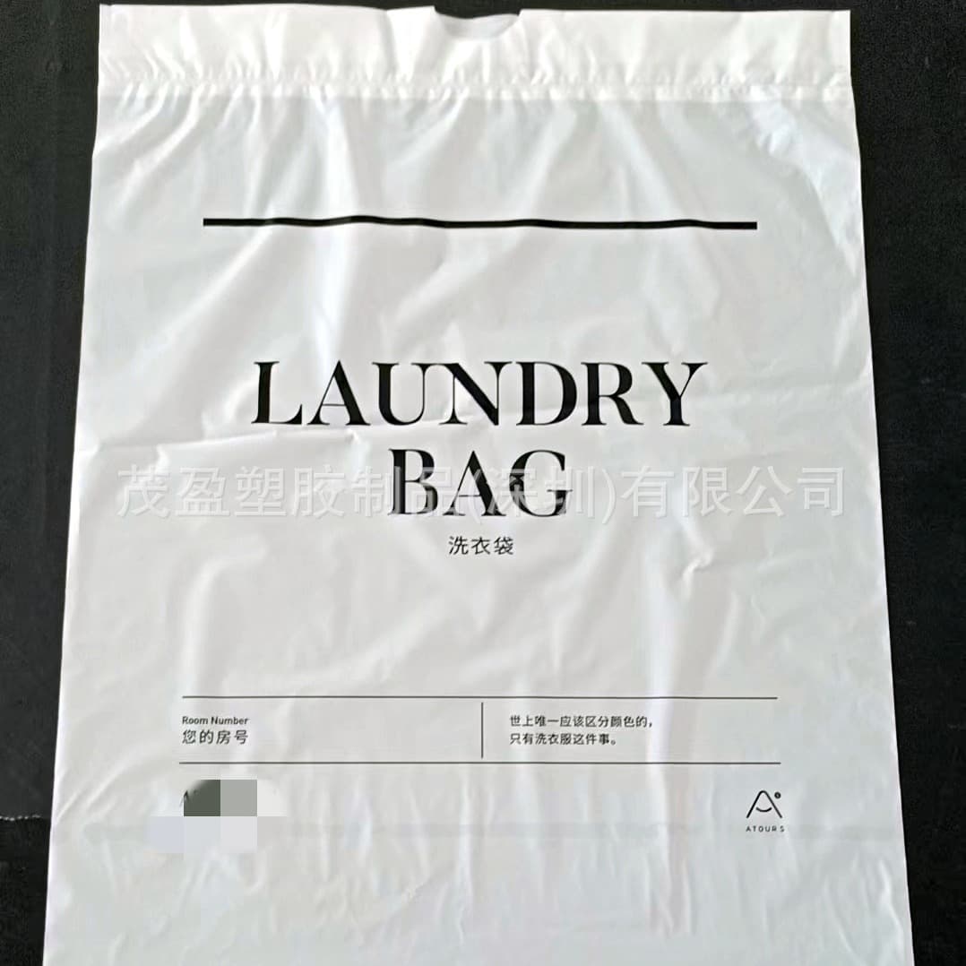 Disposable drawstring plastic laundry bags for dry cleaning shops, hotels, guest rooms, home and travel, printed