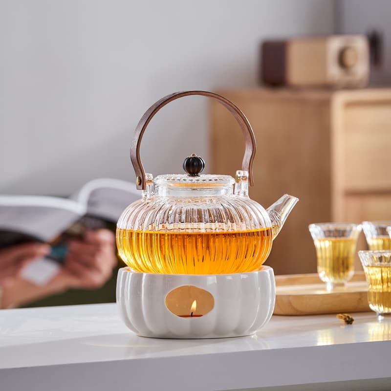 Candle-heated insulated teapot set, glass fruit and teaware, beauty salon glass teapot and cups for brewing herbal teas.