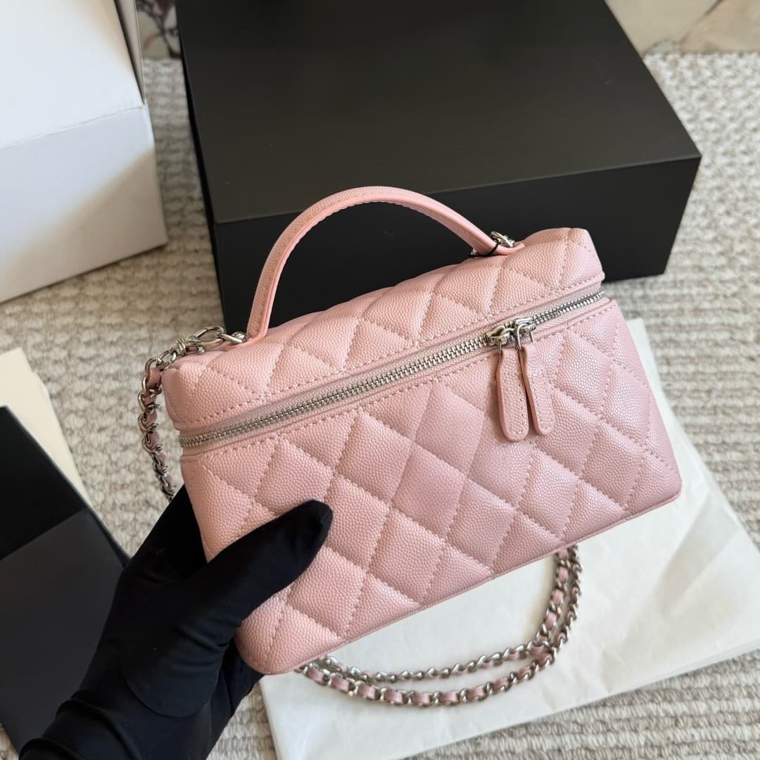 A stylish small square bag with a chain, featuring a caviar