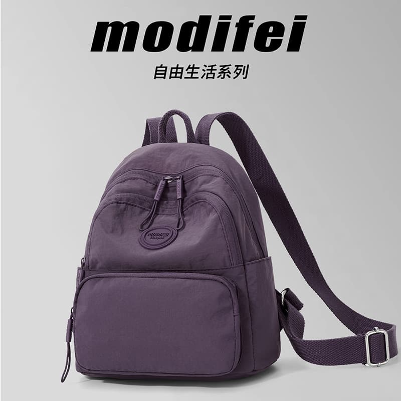 Solid color backpack for female middle school and high school students, new small school bag, casual and versatile travel bag, lightweight and fashionable backpack