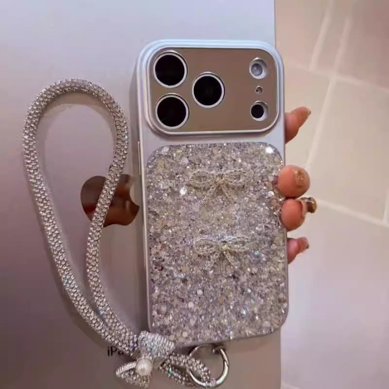 Flash diamond Korean style bow suitable for Apple 17 promax mobile phone case full package 16 personalized lanyard 15 mirror women's model