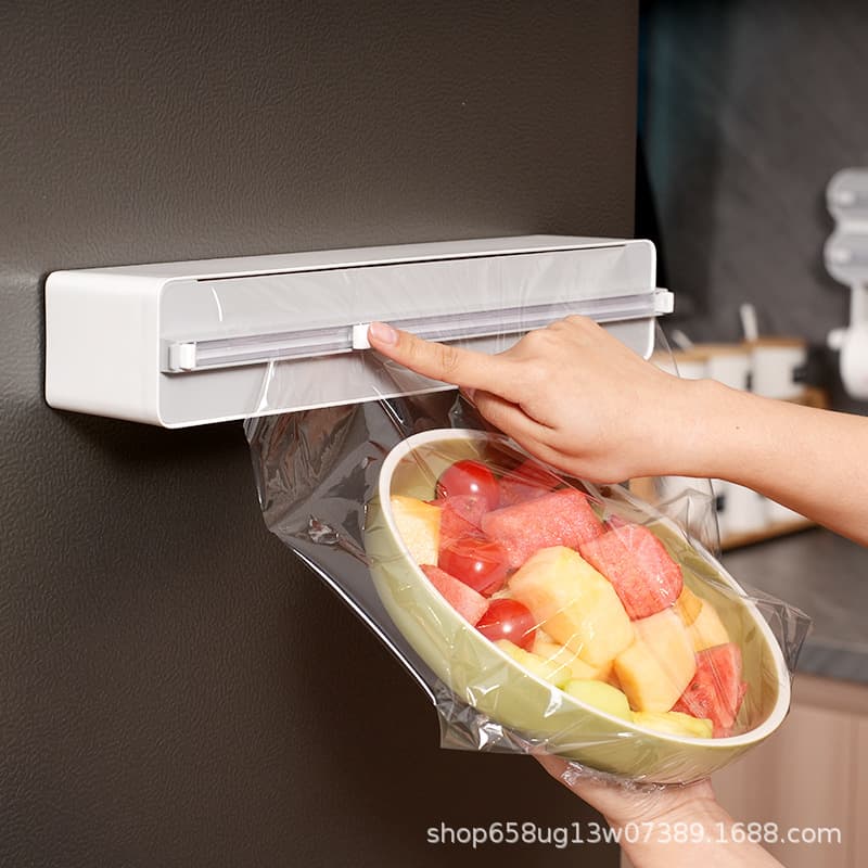 Household cling film cutter, magnetic refrigerator wall-mountable kitchen no-tear cling film cutting box.