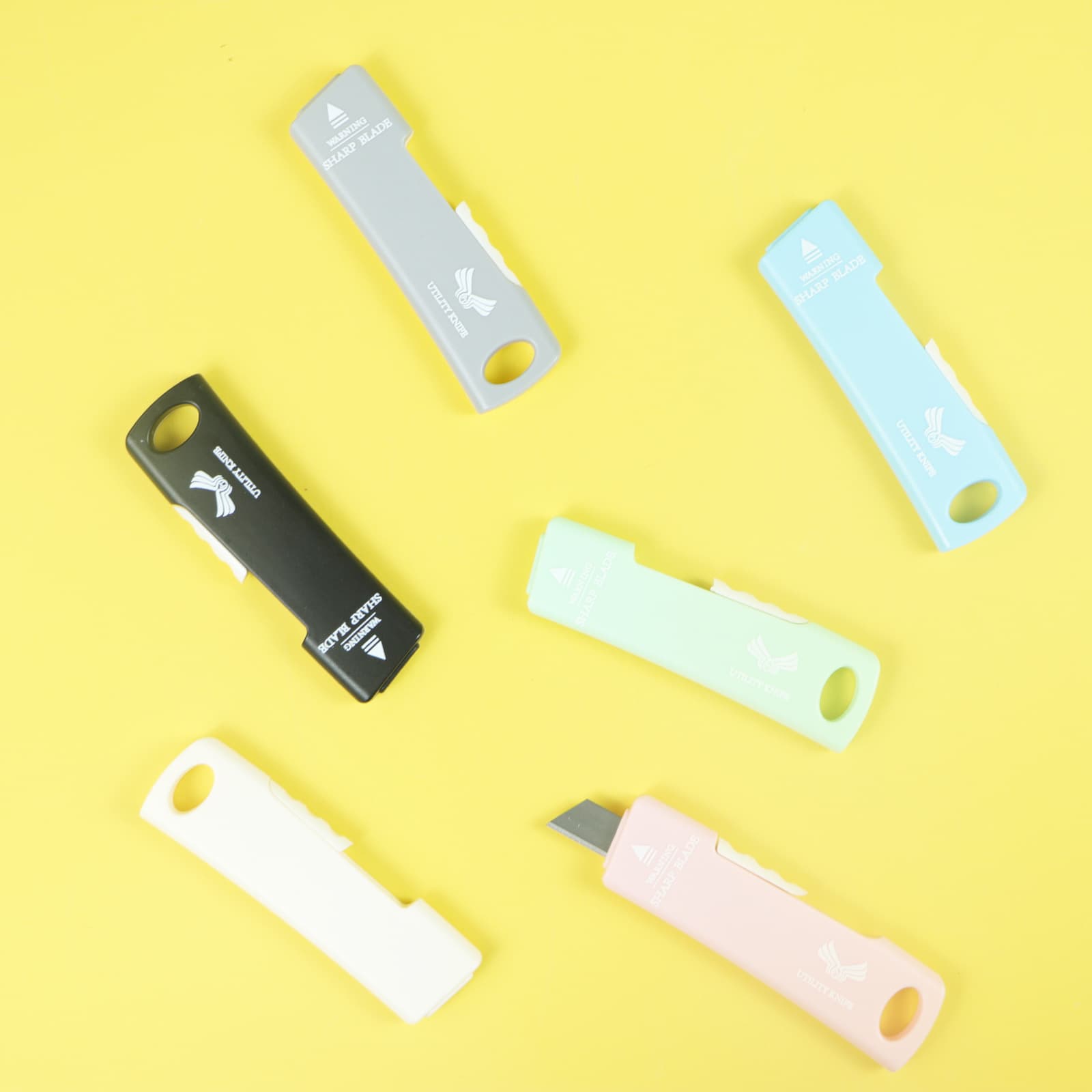 Side-push mini utility knife, portable multi-functional tool for unpacking packages and parcels, a small and mini handicraft tool for home use.