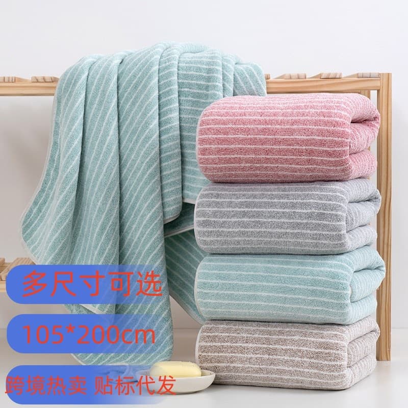 Warp-knitted coral fleece star-patterned fine stripe towels and bath towels, thickened, absorbent, less shedding, for home and beach use.