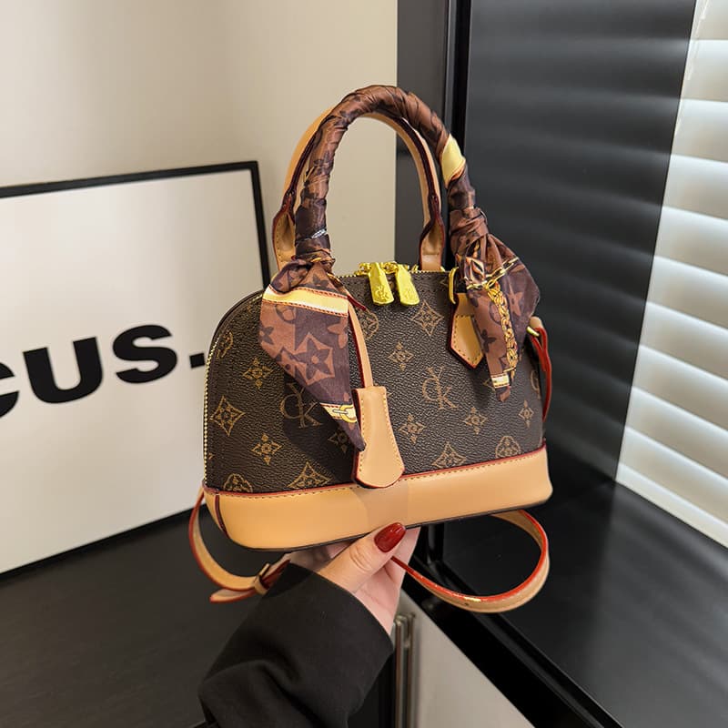 Fashionable casual personalized shell bag with simple texture single shoulder crossbody bag 2026 spring new niche women's bag