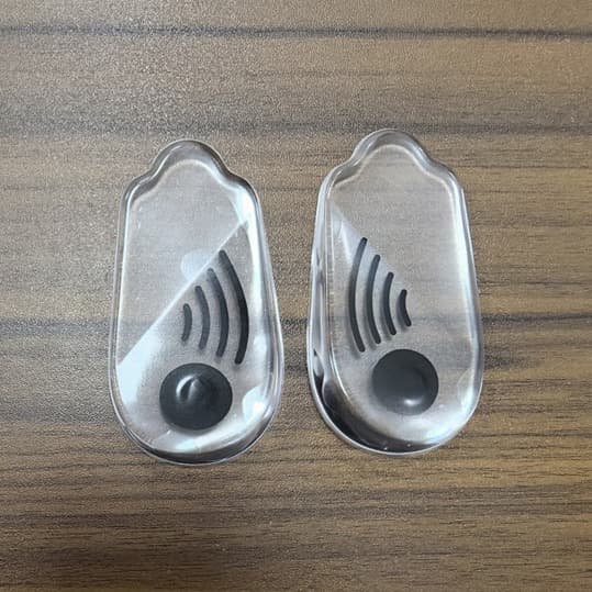 Wholesale of adult O-shaped leg and heel care corrective insoles, magnetic transparent silicone insoles for inward and outward toeing.