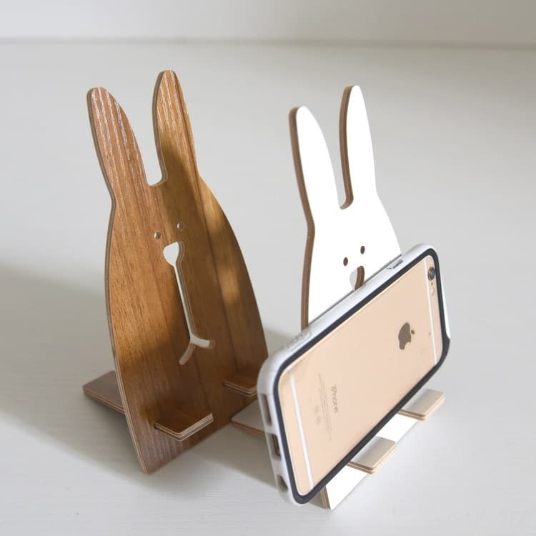 Factory direct sales of cute solid wood phone holders for office use, creative brackets, desktop phone stands.
