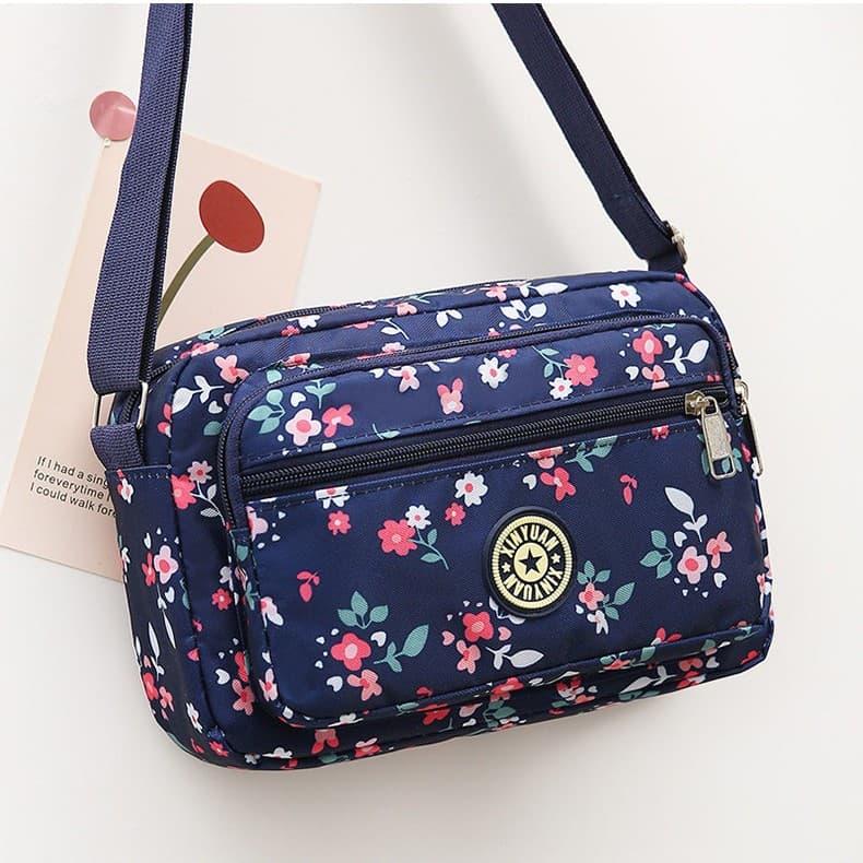 Factory direct sales of women's bags, floral fabric bags for middle-aged and elderly mothers, wholesale new style crossbody bags, multi-layer cash register bags for street vendors.