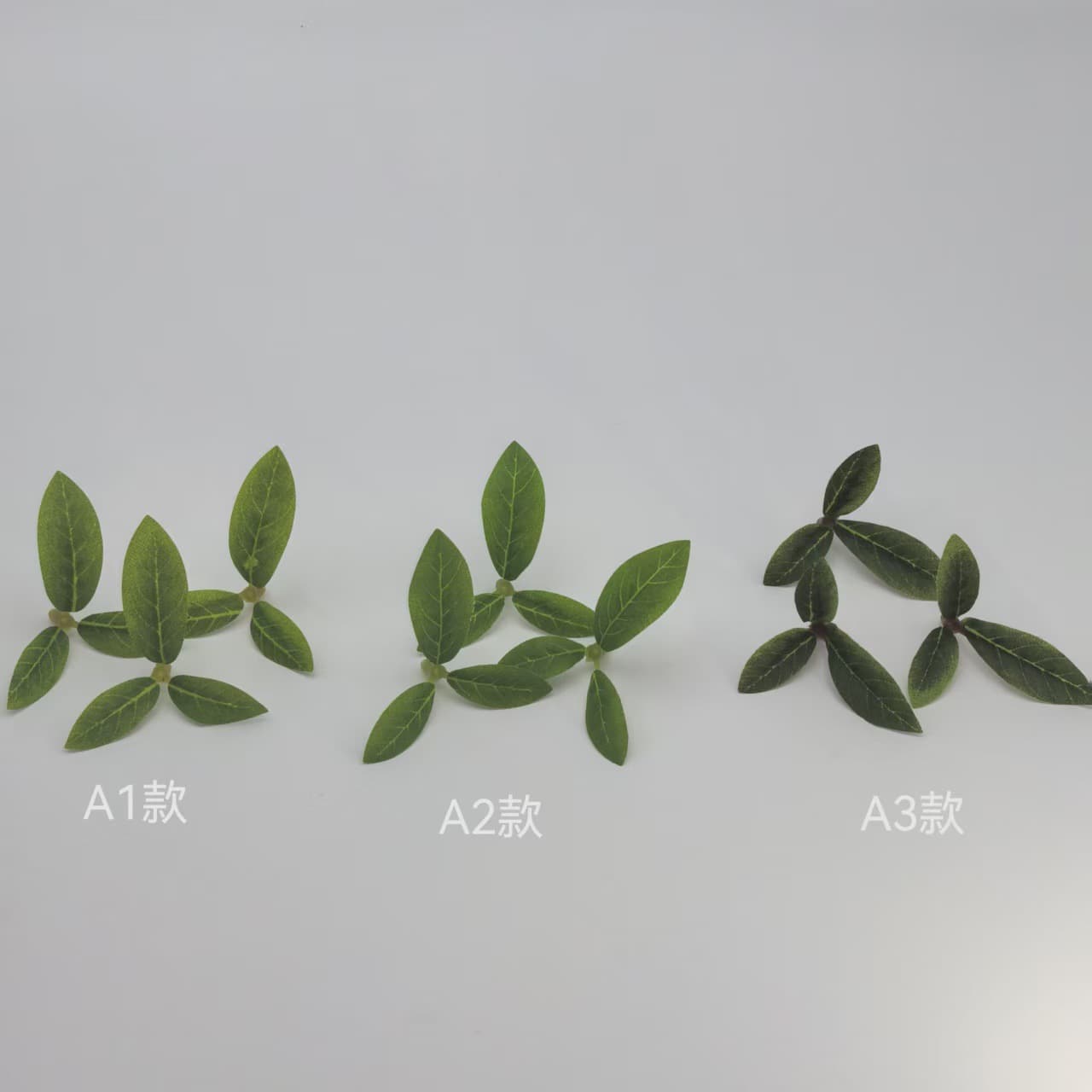 Factory direct supply of artificial pomegranate leaf artificial green plants for decorative soft furnishing projects and plant walls, available for wholesale.