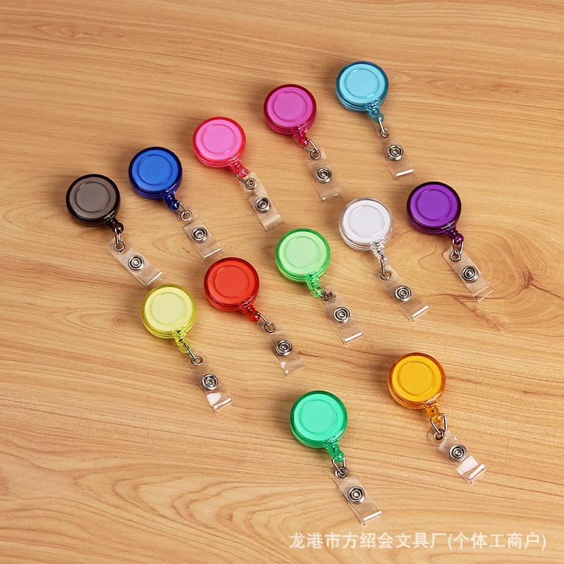 Transparent, smiley face, retractable, easy-to-pull, customizable name tag clip for hospital doctors and nurses; stretchable ID card holder clip.
