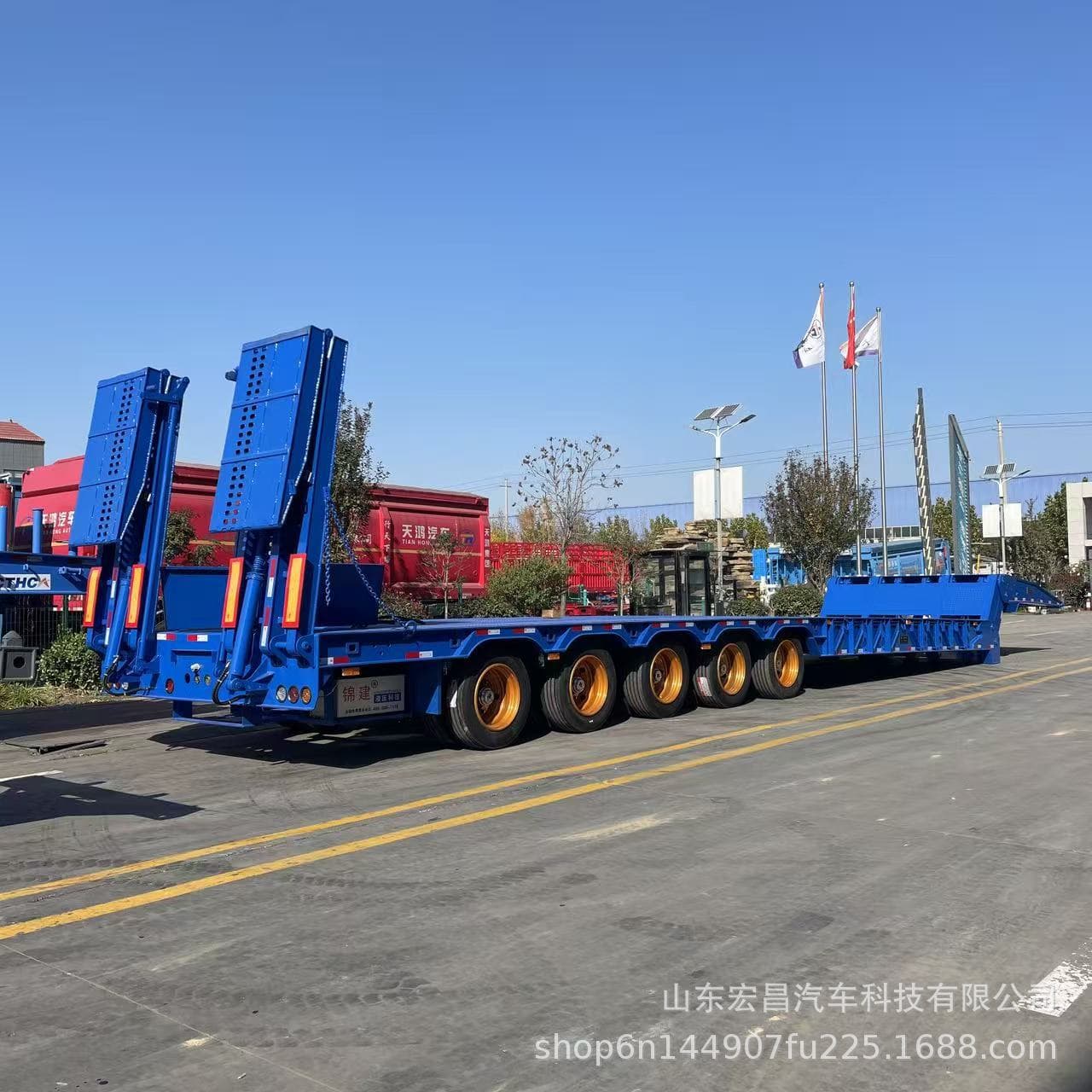 Folding front excavator, low-bed excavator, spreader, heavy transport vehicle, widening device, hydraulic ladder, cross-border