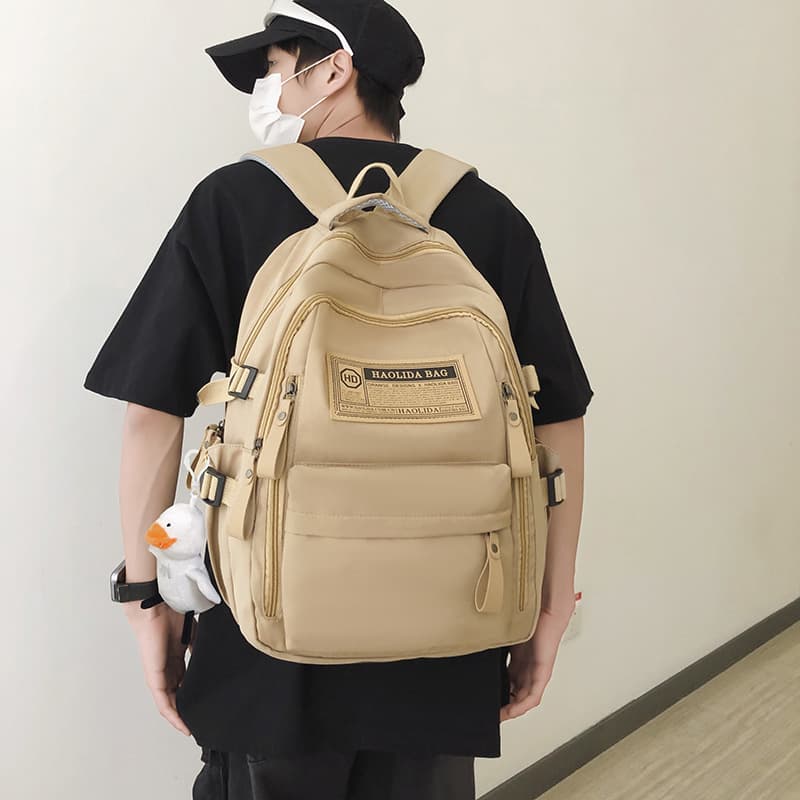 Cross-border backpack for women, simple travel laptop backpack for spring and autumn, large capacity student schoolbag for high school and junior high school students.