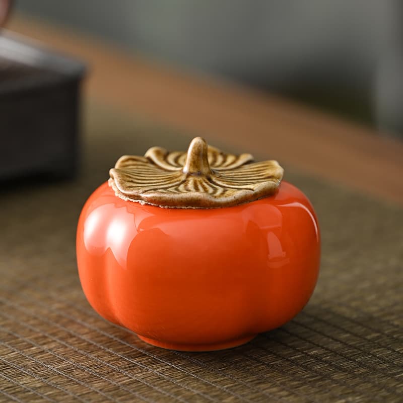 Mini persimmon-shaped ceramic sealed tea canisters, creative candy boxes for wedding favors in small packages.