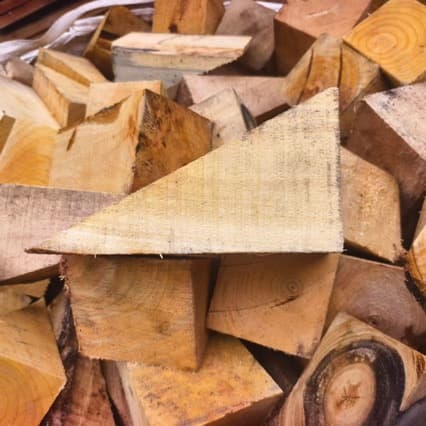 Hardwood custom-made vehicle chocks, triangular wedges, inclined wood pieces, tapered shims to specifications.