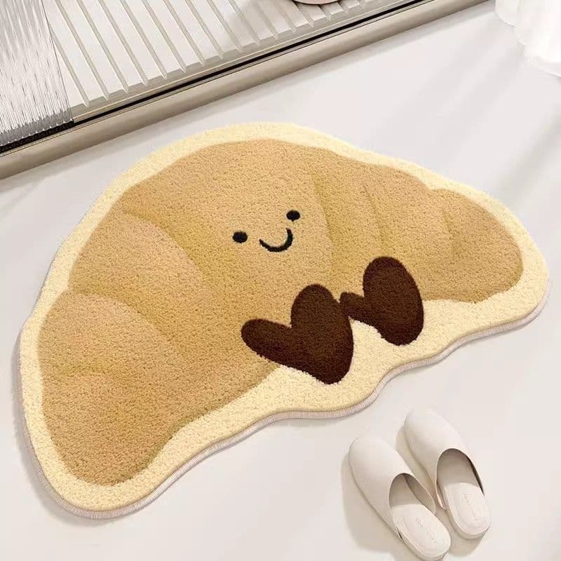Cute cartoon plush croissant bathroom doormat, absorbent, non-slip, durable toilet mat.