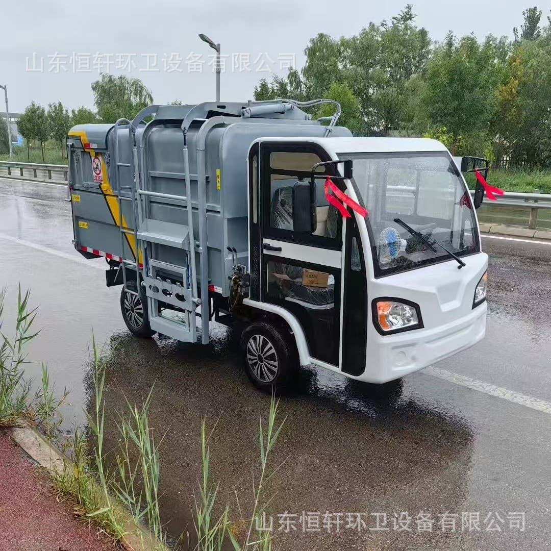 Electric four-wheeled barrel-hanging garbage trucks for community waste transport, new energy self-loading and self-dumping sanitation vehicles.